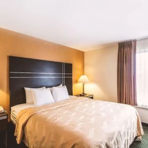 King bed at Hotel Inn Milwaukee.