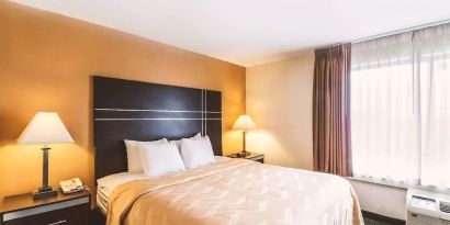 King bed at Hotel Inn Milwaukee.
