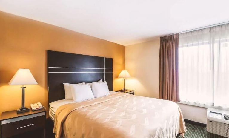 King bed at Hotel Inn Milwaukee.
