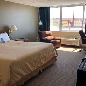 Day use room with work desk and natural light at Norwood Inn & Suites La Crosse.