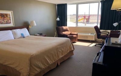 Day use room with work desk and natural light at Norwood Inn & Suites La Crosse.