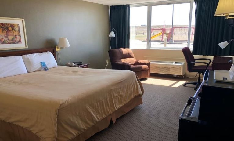 Day use room with work desk and natural light at Norwood Inn & Suites La Crosse.