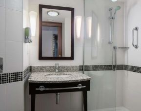 Guest bathroom with shower at Hampton By Hilton Birmingham Broad Street.