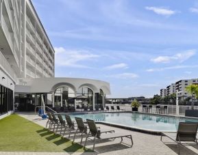 Outdoor pool with lounge chairs at Hotel Tampa Riverwalk.