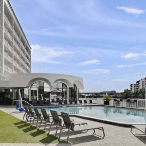 Outdoor pool with lounge chairs at Hotel Tampa Riverwalk.