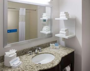 Guest bathroom with shower at Hampton Inn Los Angeles-Orange County-Cypress.