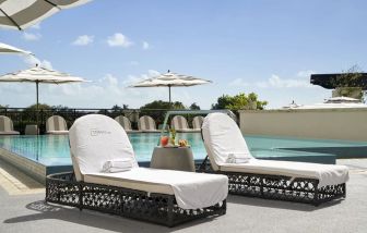 Stunning outdoor pool with sun beds at THesis Hotel Miami.