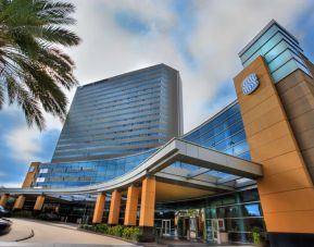 Royal Sonesta Houston Galleria’s parking area is by the hotel’s covered entranceway, which features plenty of potted plants.