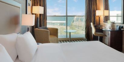 Day use room with work desk and lounge seating at DoubleTree By Hilton Newcastle International Airport.