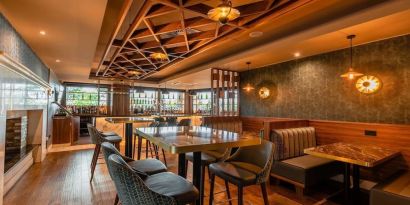 Dining area with comfortable seating at DoubleTree By Hilton Newcastle International Airport.