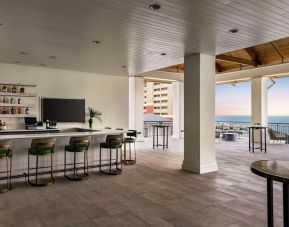 Hotel bar and lounge area at Embassy Suites By Hilton Panama City Beach Resort.