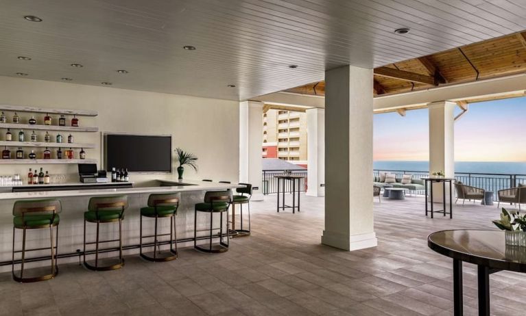 Hotel bar and lounge area at Embassy Suites By Hilton Panama City Beach Resort.