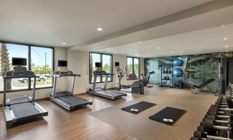 Fully equipped fitness center at Embassy Suites By Hilton Panama City Beach Resort.