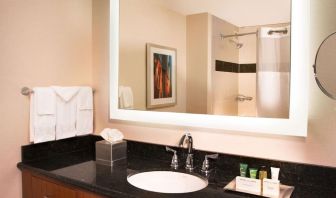 Private guest bathroom with free toiletries at Hilton Minneapolis.