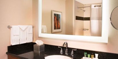 Private guest bathroom with free toiletries at Hilton Minneapolis.