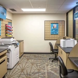 Business center with computers, printers and ergonomic chairs at Hilton Minneapolis.