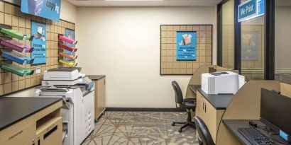 Business center with computers, printers and ergonomic chairs at Hilton Minneapolis.