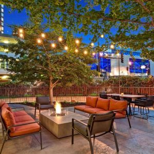 Hotel terrace with lounge seating and fire pit at Hilton Minneapolis.