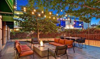 Hotel terrace with lounge seating and fire pit at Hilton Minneapolis.