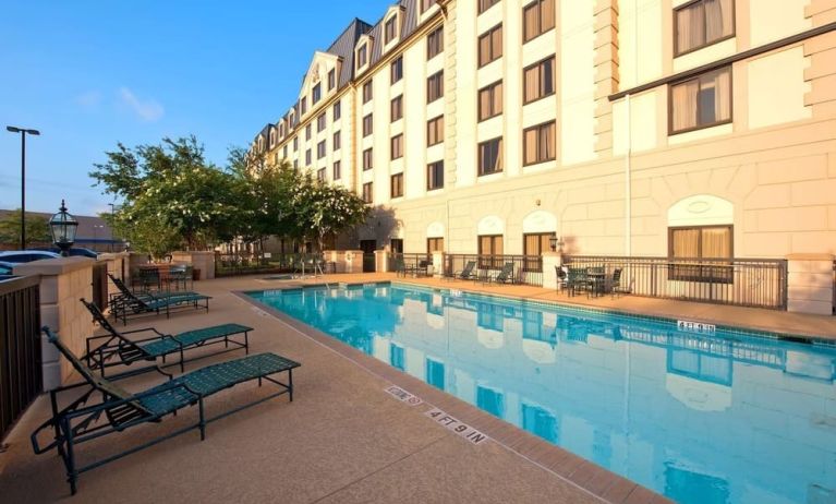 Outdoor pool with lounge chairs at Hilton Garden Inn Houston NW/Willowbrook.