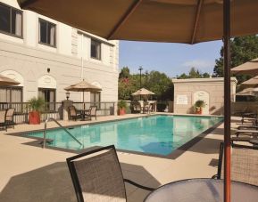 Outdoor pool with lounge seating at Hilton Garden Inn Houston NW/Willowbrook.