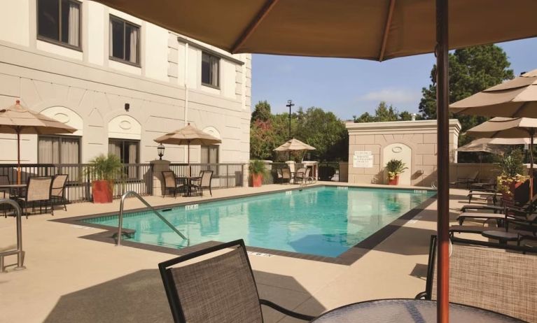 Outdoor pool with lounge seating at Hilton Garden Inn Houston NW/Willowbrook.