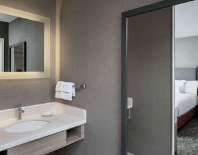 Sonesta Select Nashville Airport Suites double bed guest room, with ensuite bathroom.