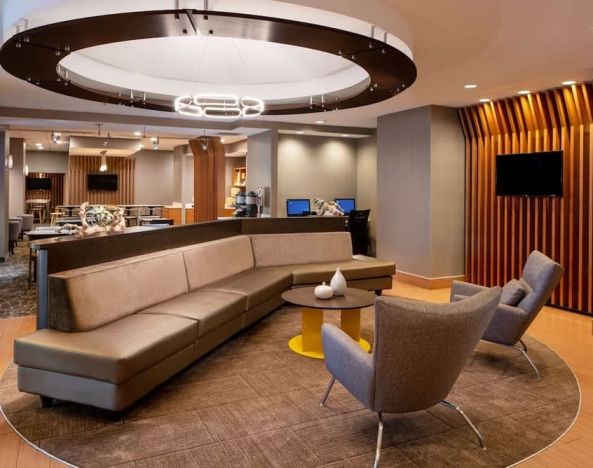 Co-working space is available in the lobby lounge, which features a sofa and pair of stylish chairs, plus a coffee table and TV.