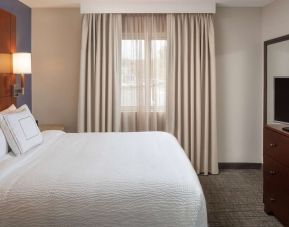 Sonesta ES Suites Nashville Brentwood guest room, featuring deluxe king bed, TV, and window.