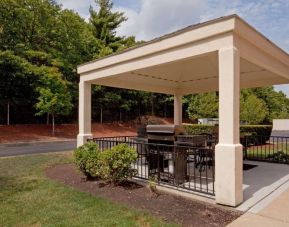 Sonesta Simply Suites Boston Braintree’s gazebo features tables and chairs where guests can relax and socialize, plus a barbecue.