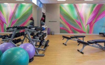Sonesta Miami Airport’s fitness center is equipped with racks of free weights, multiple benches, and gym balls.