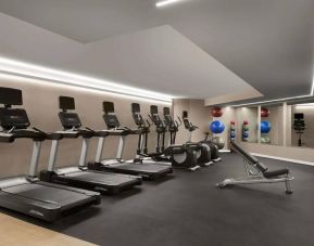Sonesta Silicon Valley’s fitness center is equipped with assorted exercise machines, a bench, and gym balls.