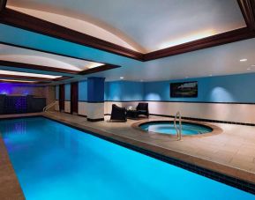 The Stephen F Austin Royal Sonesta Hotel’s narrow indoor pool has two armchairs nearby, plus a hot tub.