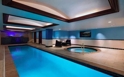 The Stephen F Austin Royal Sonesta Hotel’s narrow indoor pool has two armchairs nearby, plus a hot tub.