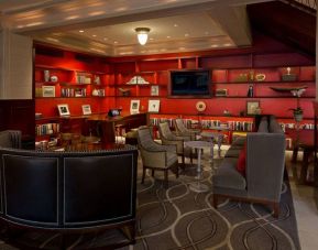 The hotel’s lobby lounge has extensive reading material, comfy chair and sofa seating, and numerous coffee tables.
