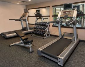 The hotel’s fitness center has racks of free weights, a bench, and treadmills for guests to use.