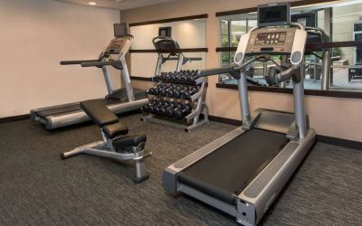 The hotel’s fitness center has racks of free weights, a bench, and treadmills for guests to use.