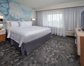 Double bed guest room in Sonesta Select Allentown Bethlehem Airport, featuring window and TV.