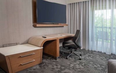 Sonesta Select Allentown Bethlehem Airport guest room workspace, including desk, chair, and huge television.