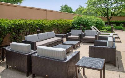Sonesta Select Allentown Bethlehem Airport’s terrace has coffee tables, armchairs, and sofa seating.