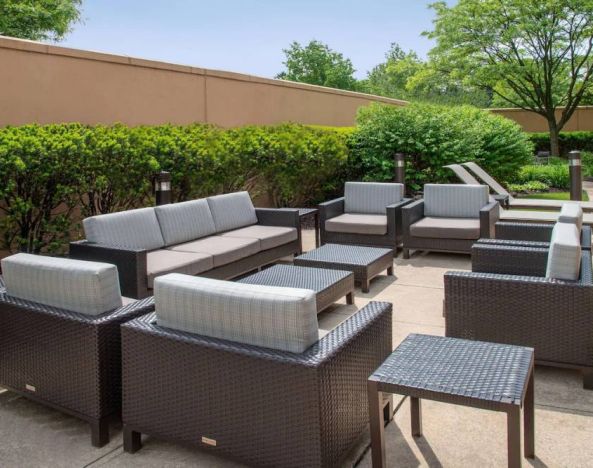 Sonesta Select Allentown Bethlehem Airport’s terrace has coffee tables, armchairs, and sofa seating.