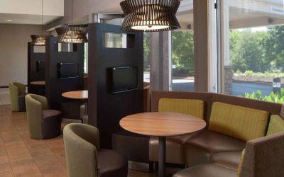 Sonesta Select Chattanooga Hamilton Place’s media pods offer cozy nooks for co-working with comfy seating, a TV, and coffee table each.