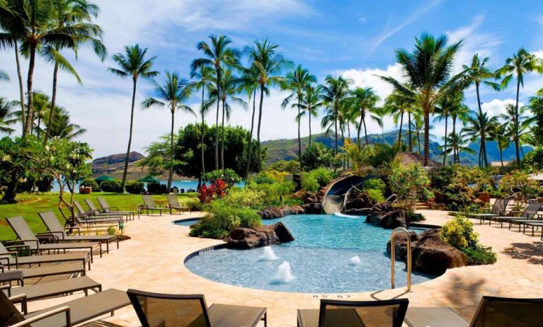Beautiful outdoor pool with lounge chairs at Royal Sonesta Kaua'i Resort Lihue.