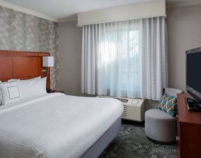 Double bed guest room in Sonesta Select Boston Lowell Chelmsford, including window and television.