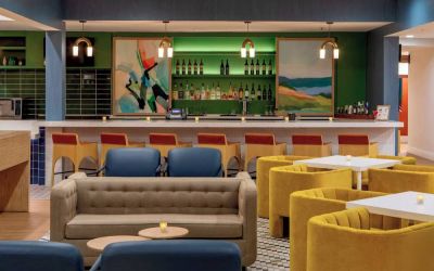 Sonesta Select Boston Foxborough Mansfield’s on-site restaurant The Commons has tall bar stool and table seating, plus a wide range of beverages at the bar.