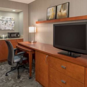 Sonesta Select Seattle Bellevue Redmond guest room workspace, featuring desk and chair, plus TV.