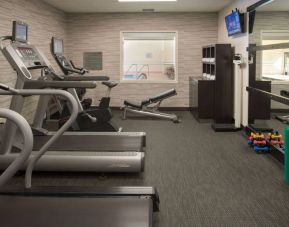Free weights and various exercise machines are available in the hotel fitness center.