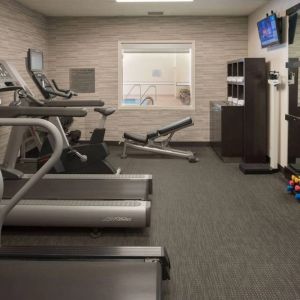Free weights and various exercise machines are available in the hotel fitness center.