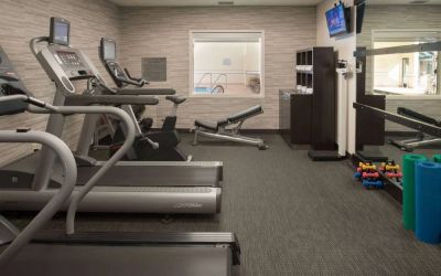 Free weights and various exercise machines are available in the hotel fitness center.