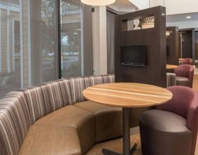 The hotel’s media pods offer a cozy setting for socializing or work, and each has a coffee table and TV.